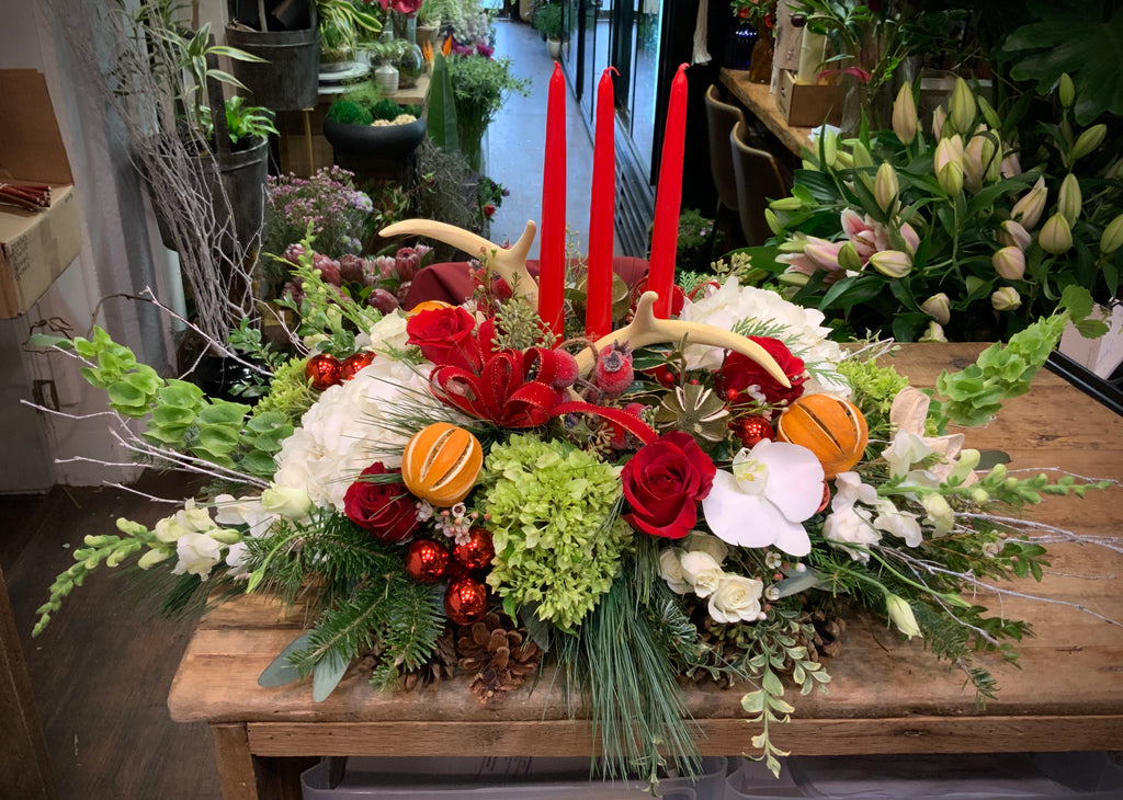 Holiday Centerpiece with Oranges, Faux Antlers and Candles